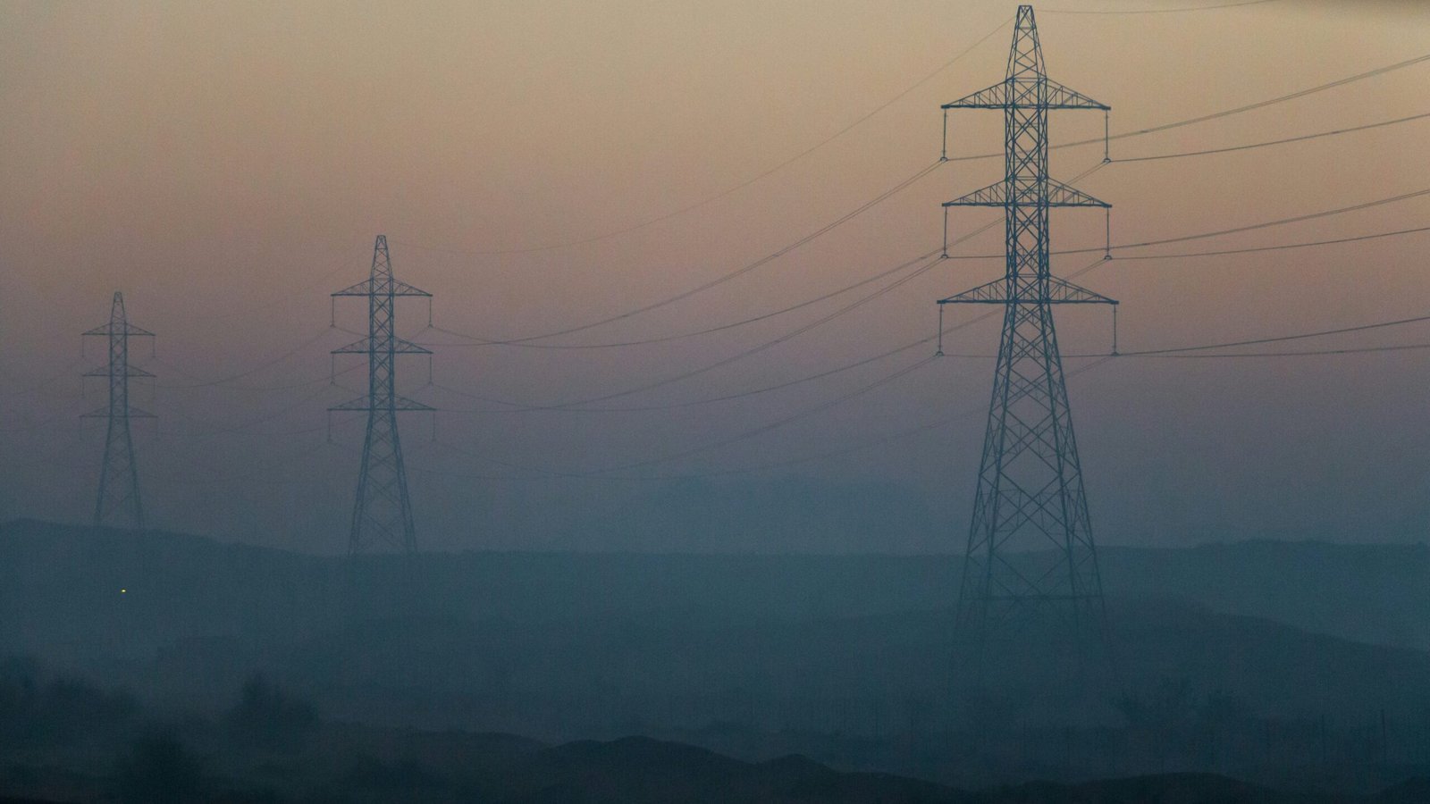 electrical towers during golden hour